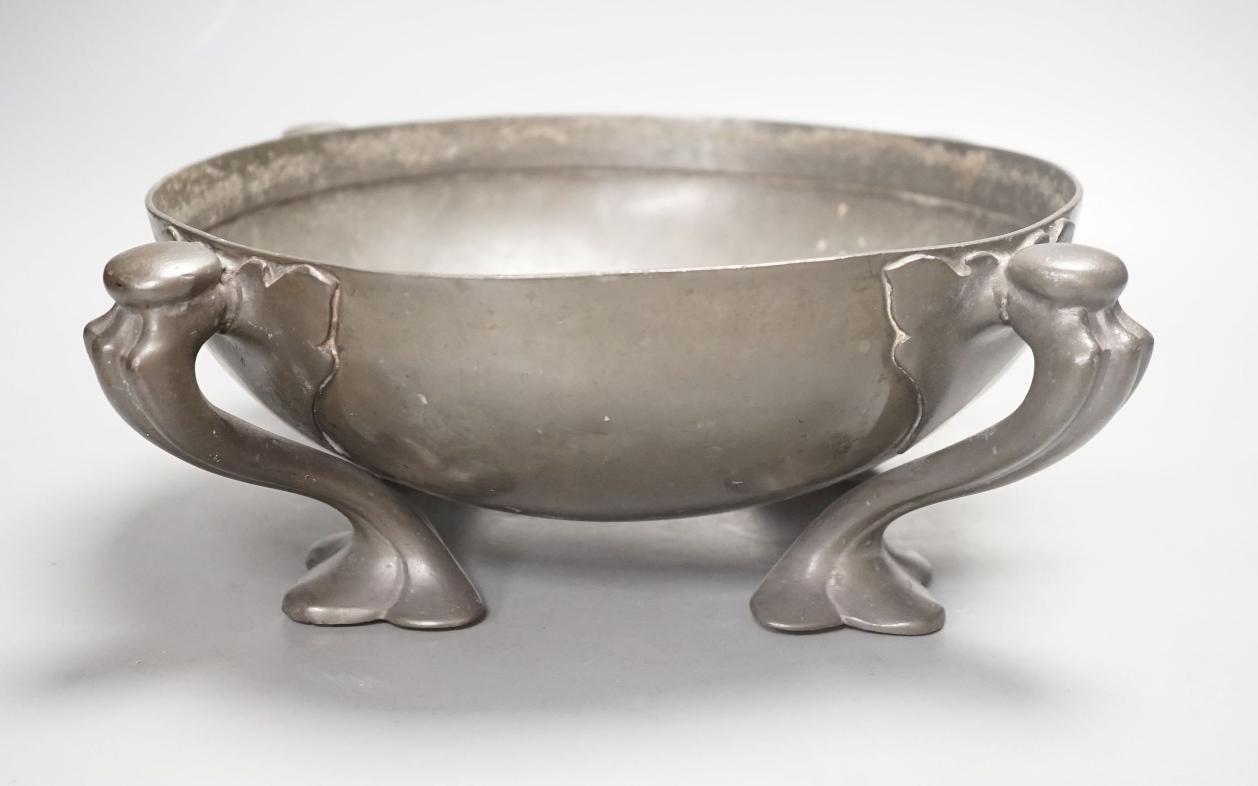 A Tudric four-footed pewter bowl designed by Oliver baker, 33cm, stamped Tudric 067